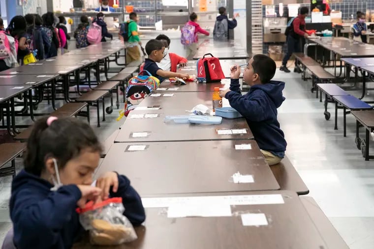 Students eat lunch in the cafeteria at William H. Ziegler Elementary School in 2021.