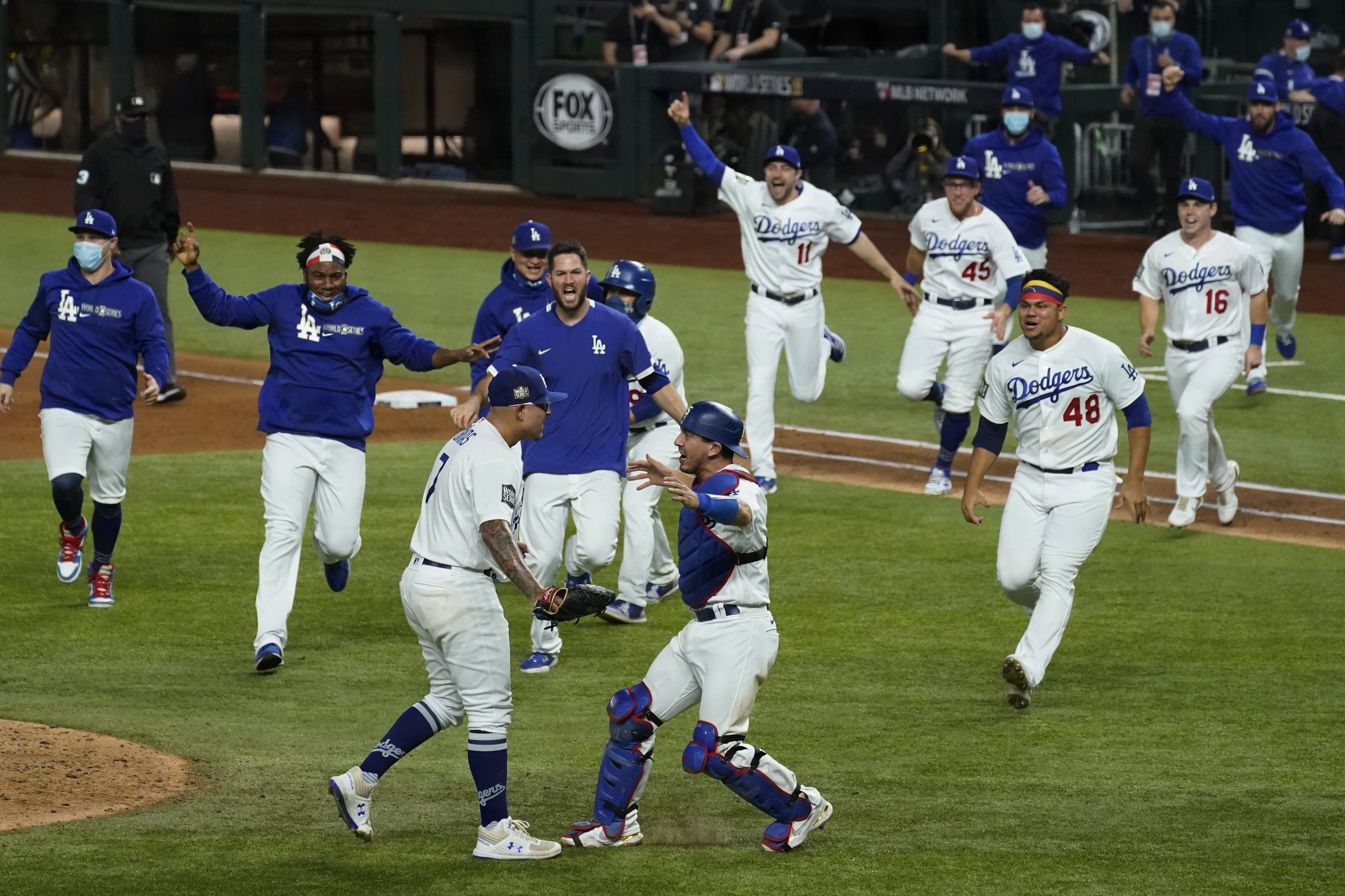 Boston Red Sox Mookie Betts holds up the Commissioner's Trophy as the Sox  celebrate after beating the Los Angeles Dodgers in game 5 of the MLB 2018 World  Series at Dodger Stadium in Los Angeles on October 28, 2018. The Red Sox  defeated the