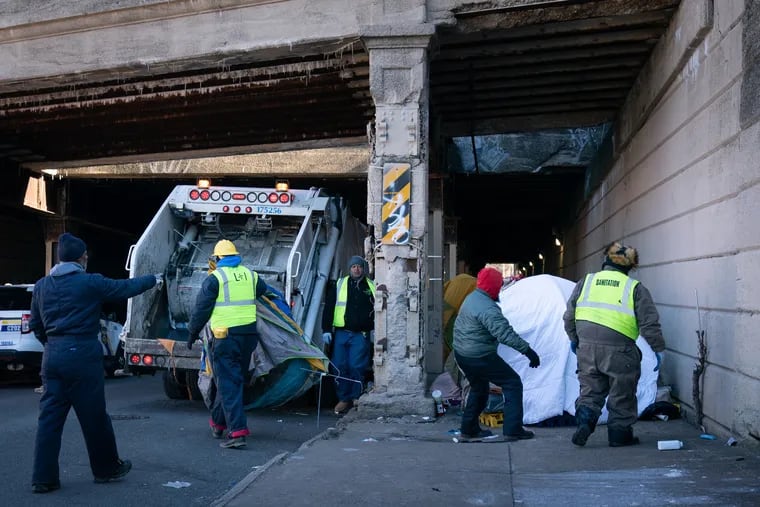 City workers clear tents and other debris from the Emerald Street encampment in Kensington, Philadelphia,  January 31, 2019. JESSICA GRIFFIN / Staff Photographer