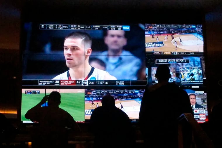Customers watch a game during the NCAA March Madness college basketball tournament at the Hard Rock casino in Atlantic City on March 22. Casinos in eight states are opening or expanding retail sportsbooks to capture in-person sports betting business, even while most of the growth in the new industry is forecast to be online.