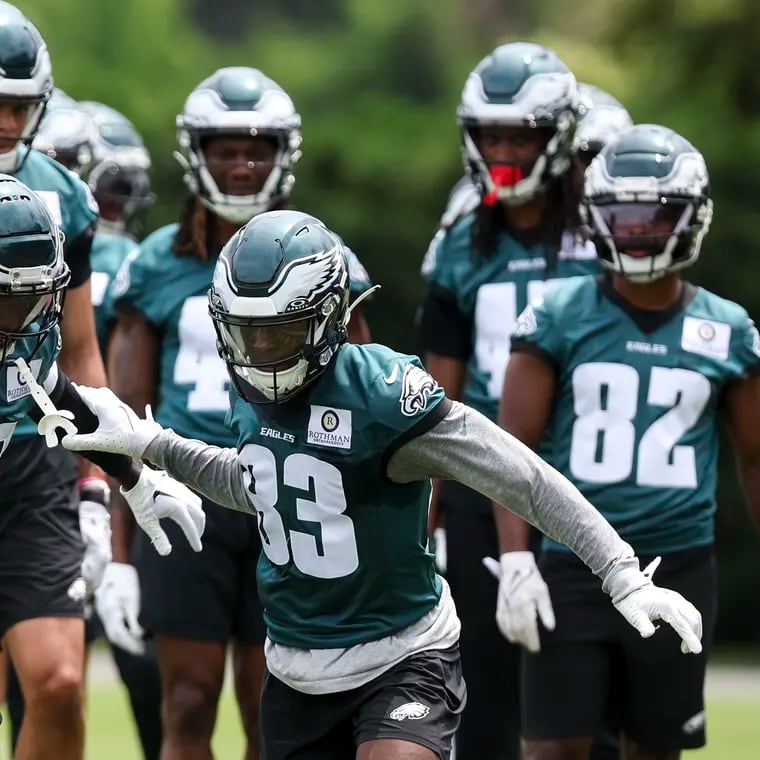 Parris Campbell (left) and John Ross run drills during minicamp on Wednesday. The speedy duo leads the race for the Eagles' third wide receiver spot.