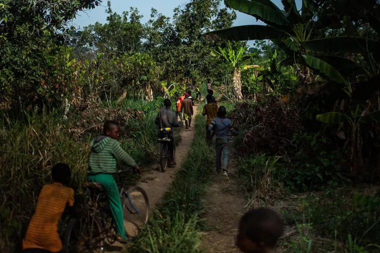 Children from Burkina Faso leave a cocoa farm near Bonon, Ivory Coast, at the end of the workday. U.S. data show that despite promises from chocolate companies to protect against child labor, nearly two million children still work on cocoa farms.