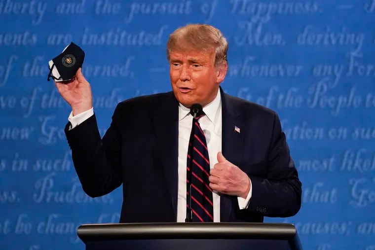 President Donald Trump held up his face mask during the first presidential debate Tuesday at Case Western University and Cleveland Clinic.