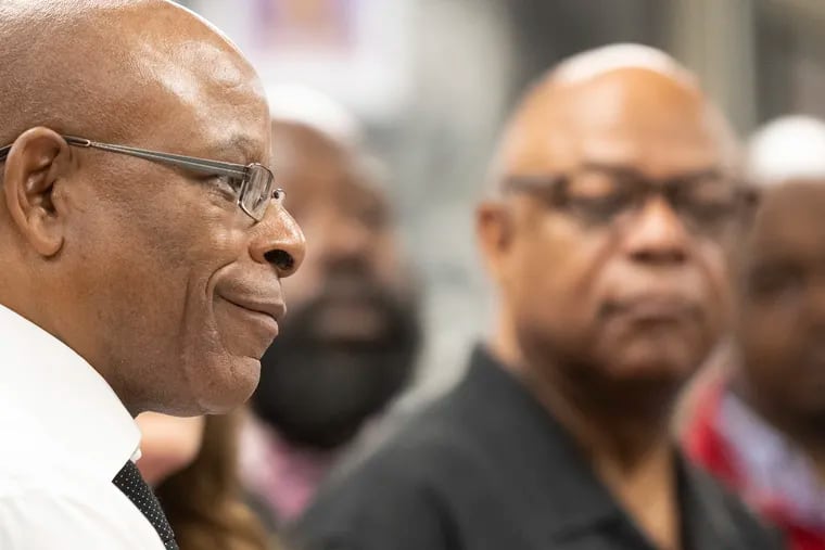 William Sax, South Philadelphia High School social studies teacher, listens to Philadelphia Superintendent Tony B. Watlington Sr. speak during a news conference Friday about funding negotiations to fix the district's aging and toxic school buildings.