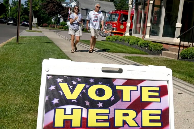 Voters arrive outside their polling place at the Moorestown Fire Dept. Hose Company No. 1 in Moorestown on primary election day Tuesday.