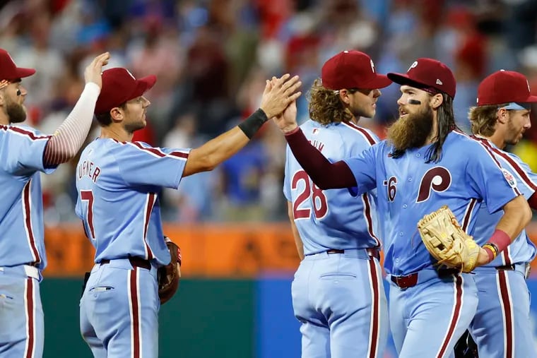 The Phillies celebrate their 5-1 win over the Dodgers on Thursday.