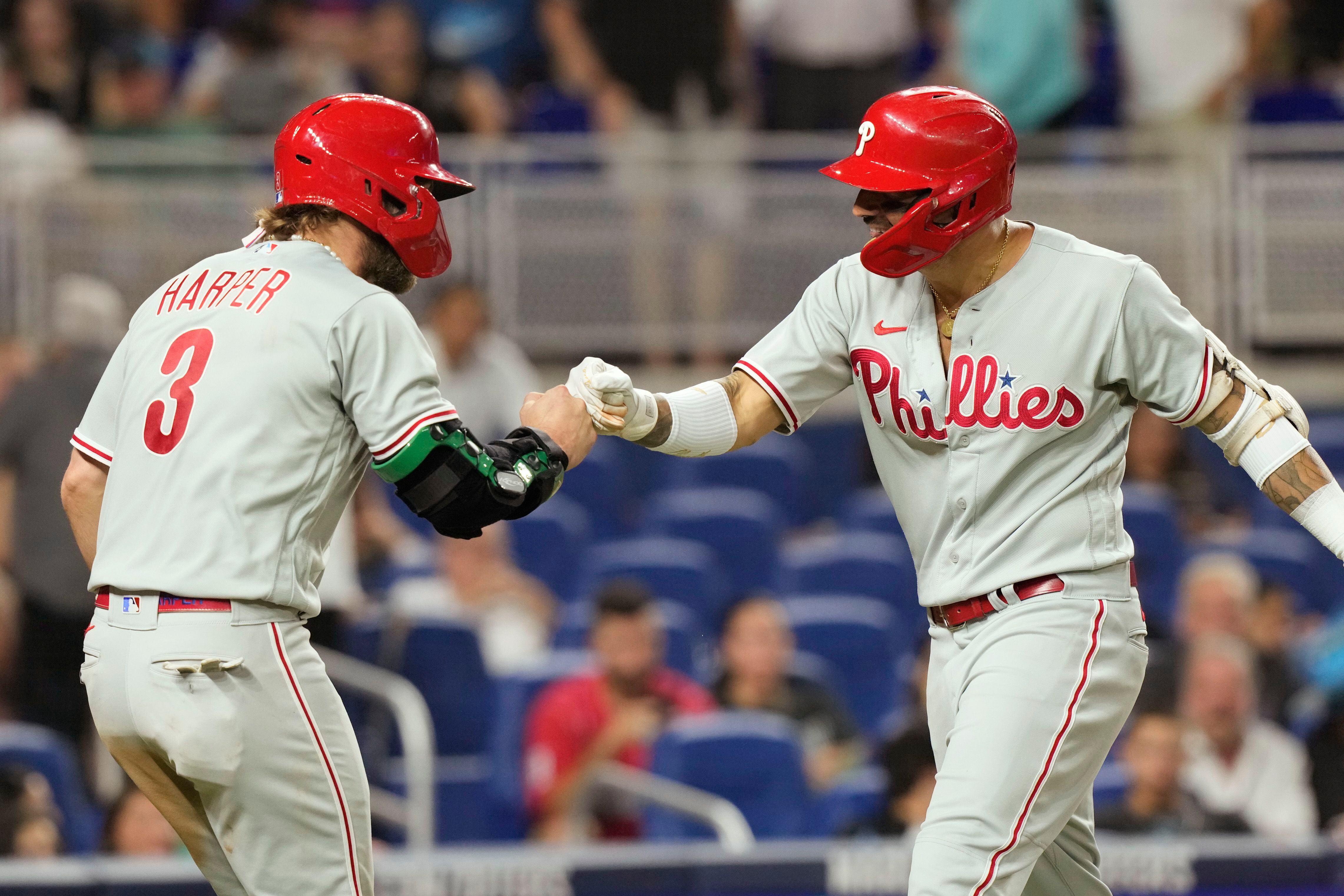 Miami Marlins' Jesus Sanchez, left, is congratulated by first base