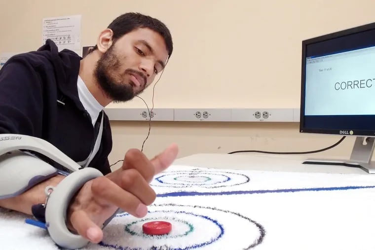 German Aldana, who has paralysis, participates in experimental trials of what are called brain-computer interfaces. Scientists are trying to read the brain-cell activity connected to his thoughts about physical movement and use that to trigger actions - either from a computer cursor, a keypad or assistive devices.