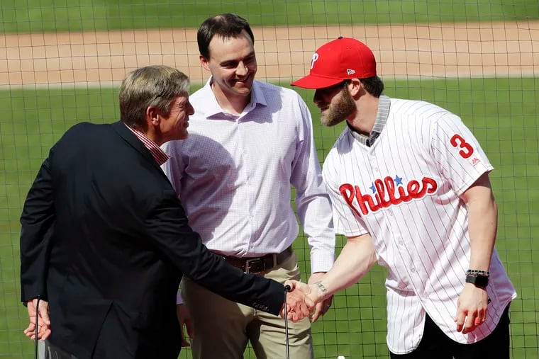 John Middleton (left) and Matt Klentak set out to change expectations. That goal was realized when Bryce Harper took the dais for his introductory press conference on March 2.