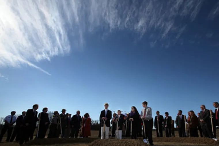 A group of family members and dignitaries prepare to turn their shovels during the ground breaking ceremony for the September 11 Flight 93 National Memorial in Shanksville, Pa.  (Laurence Kesterson / Staff Photographer)