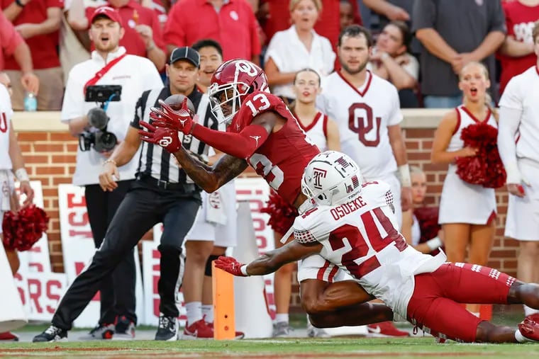 Temple cornerback Ben Osueke (24) defends as Oklahoma wide receiver J.J. Hester fails to haul in a pass in the end zone on Friday.