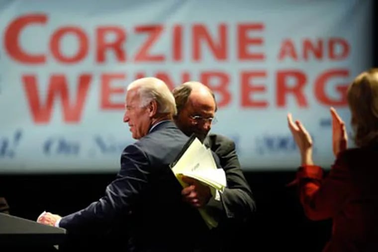 New Jersey Gov. Jon S. Corzine, center, and Vice President Joe Biden embrace before Biden addressed the New Jersey AFL-CIO. (AP Photo/Matt Rourke)