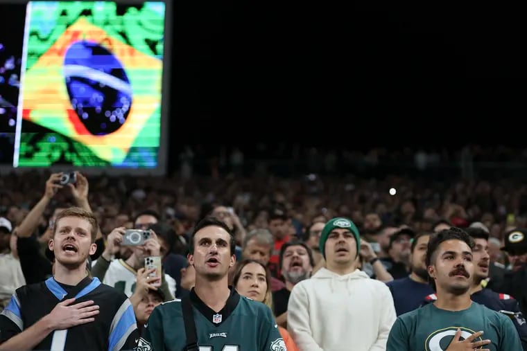 NFL fans sing Brazil's national anthem before the Eagles season opener against the Green Bay Packers at Corinthians Arena in São Paulo, Brazil.