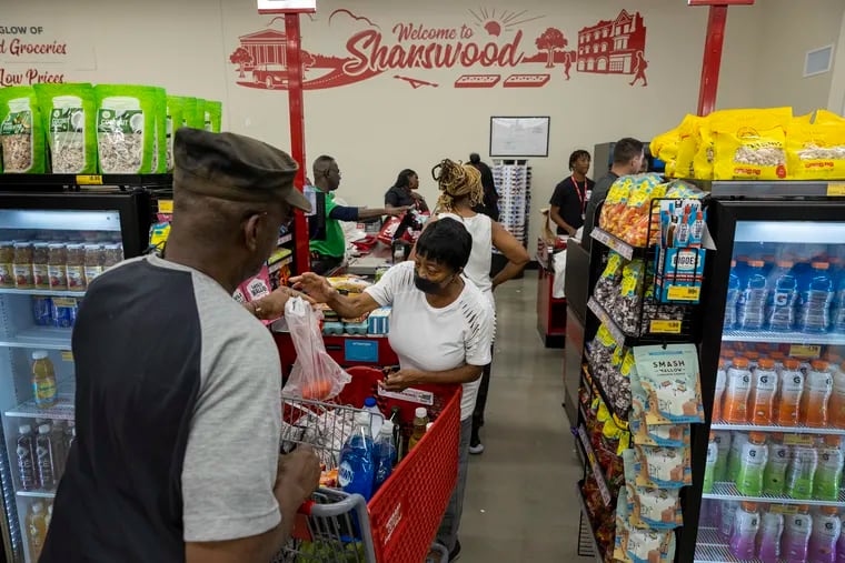 Philly-area consumers, like those shopping at a North Philadelphia Grocery Outlet in July 2022, say they are feeling the sting of higher grocery prices, but also finding ways to save after years of inflation.