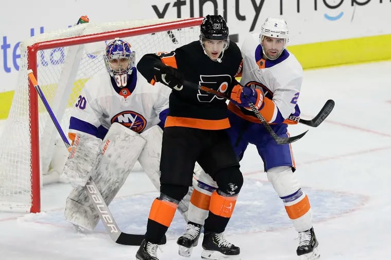 Left winger Oskar Lindblom, battling against the Islanders earlier this season, was among several Flyers taken out of Wednesday's lineup against the Rangers.