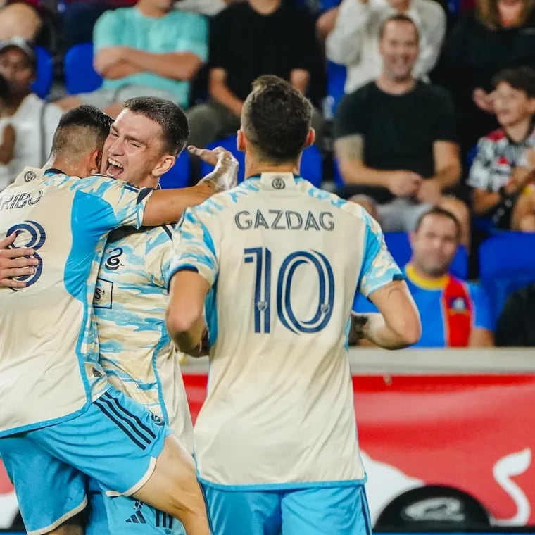 Mikael Uhre (center) celebrates with Tai Baribo (left) and Dániel Gazdag (right) after one of the Union's goals against the Red Bulls on Saturday.