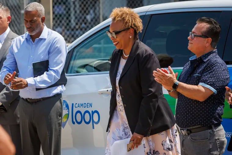 Former Camden Mayor Dana L. Redd, center, pictured with Mayor Victor Carstarphen (left) and Council President Angel Fuentes in 2023.