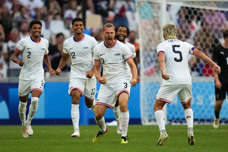 Walker Zimmerman (center) celebrates with teammates including Union right back Nathan Harriel (left) after scoring the U.S.' second goal against New Zealand.