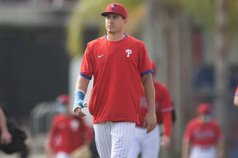 PHILS JT REALMUTO CATCHES IN SPRING TRAINING WEARING A CAST