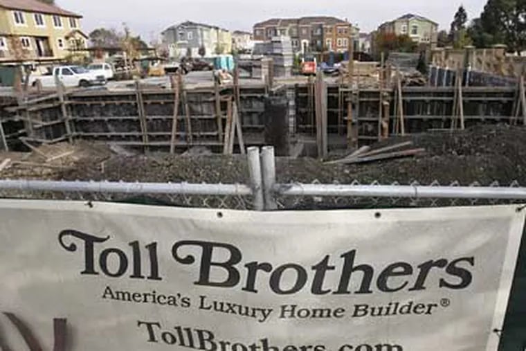 Toll Brothers Inc. said Thursday its fiscal fourth-quarter loss narrowed slightly as it took fewer write-downs on land values, but warned that fiscal 2009 revenue will fall significantly below 2008 levels. (Paul Sakuma/AP Photo)