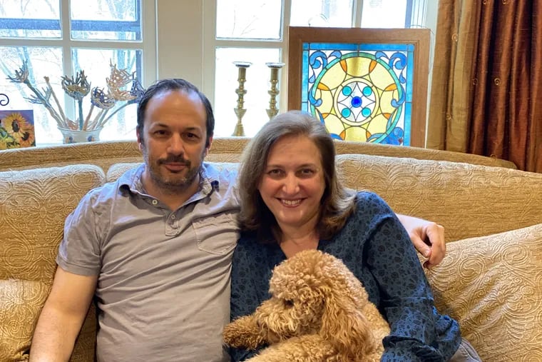 Benjamin Abella, 49, and Ursina Teitelbaum, 50, of Ardmore, are married doctors who work at the Hospital of the University of Pennsylvania. Like many Jews, the couple and their three teenage children will be celebrating a scaled-down Passover this year because of the coronavirus. Also pictured is Ruby Alice, the family's goldendoodle.