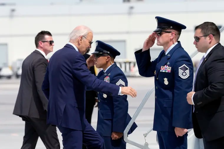 President Joe Biden walks up the steps of Air Force One at Harry Reid International Airport in Las Vegas. Biden has tested positive for COVID.