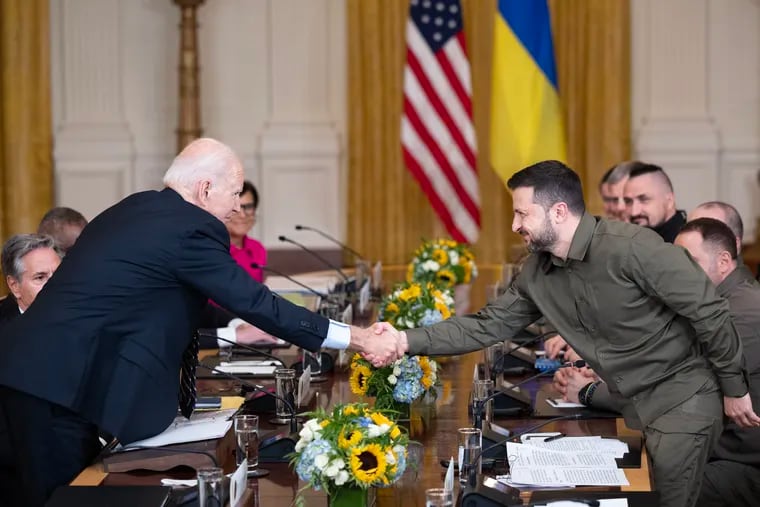 President Joe Biden and Ukrainian President Volodymyr Zelensky shake hands during a meeting at the White House on Sept. 21. Biden has failed to clearly state the U.S. end goals in the conflict, writes Trudy Rubin.