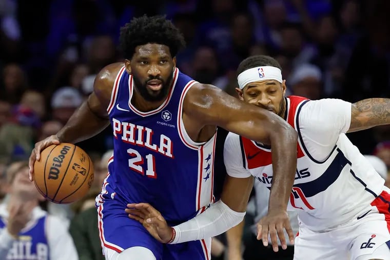 Sixers center Joel Embiid drives against the Wizards’ Daniel Gafford on Monday.
